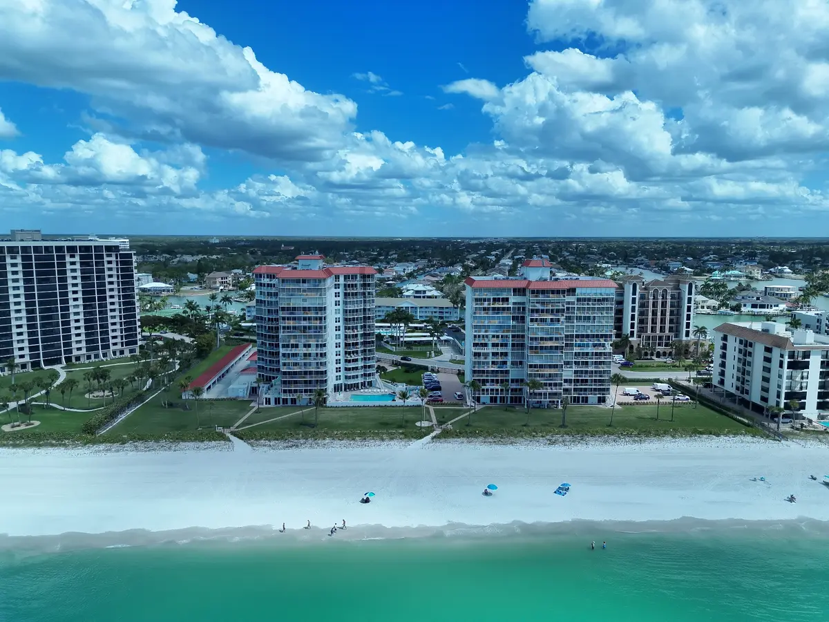 Aerial view of beachfront condominiums and coastline