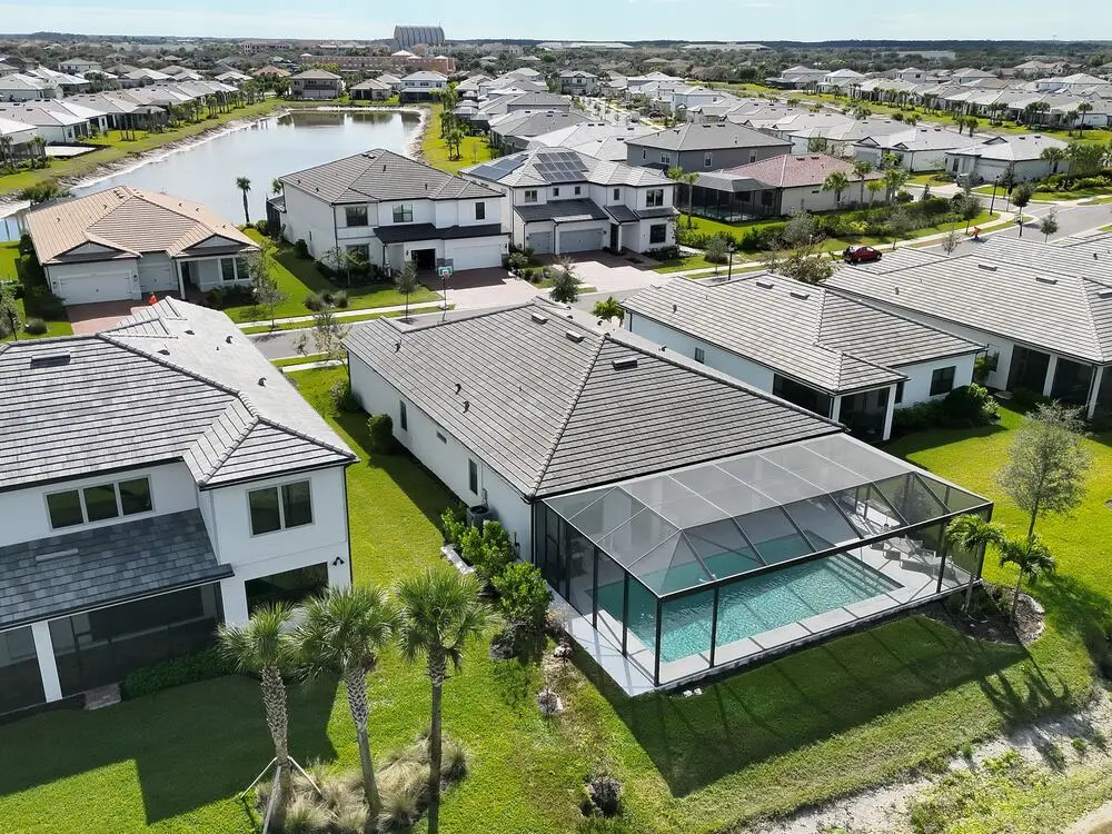 Wide aerial view of a Southwest Florida property and surrounding neighborhood