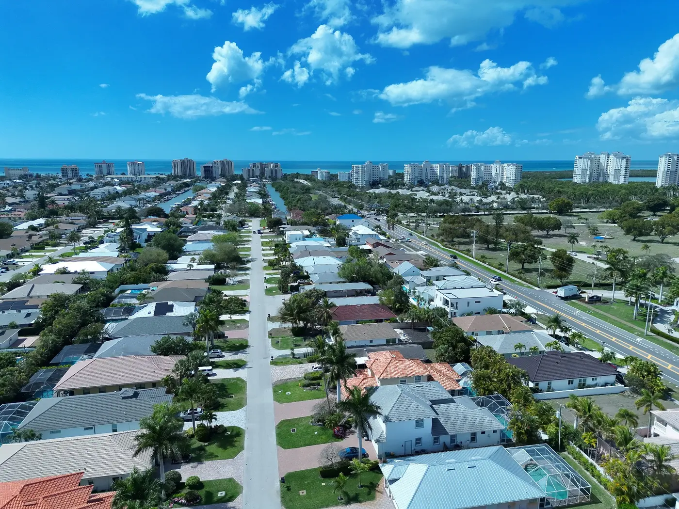 Wide aerial view of a Southwest Florida neighborhood and surrounding area