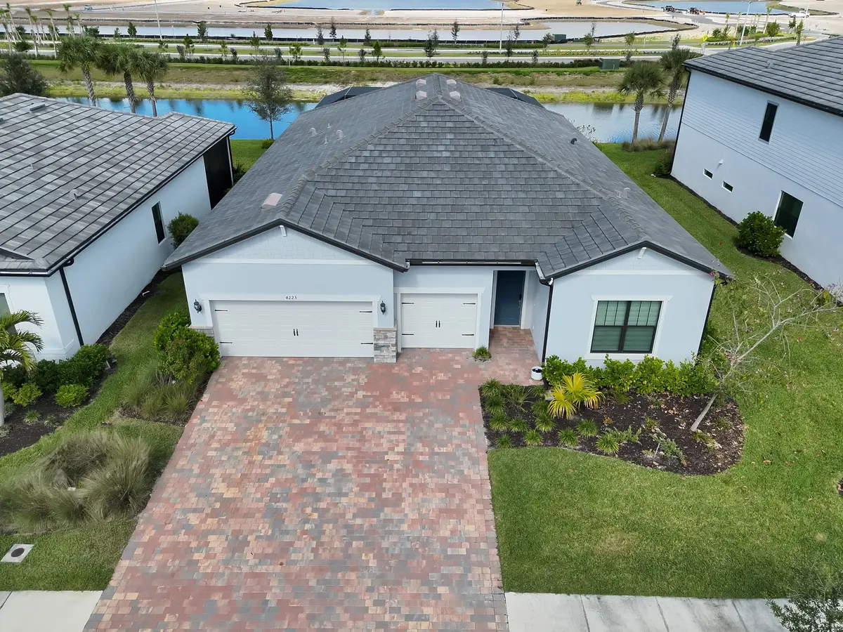 Elevated aerial view of a home's roof and front exterior